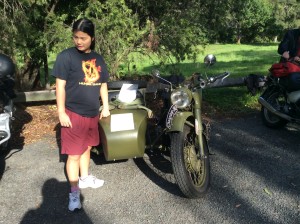 My daughter Rosie stands near my 1962 Chiang Jiang sidecar outfit.