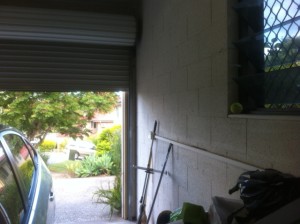 This photo shows the garage door in the correct position: one and a half bricks above the bottom of the window