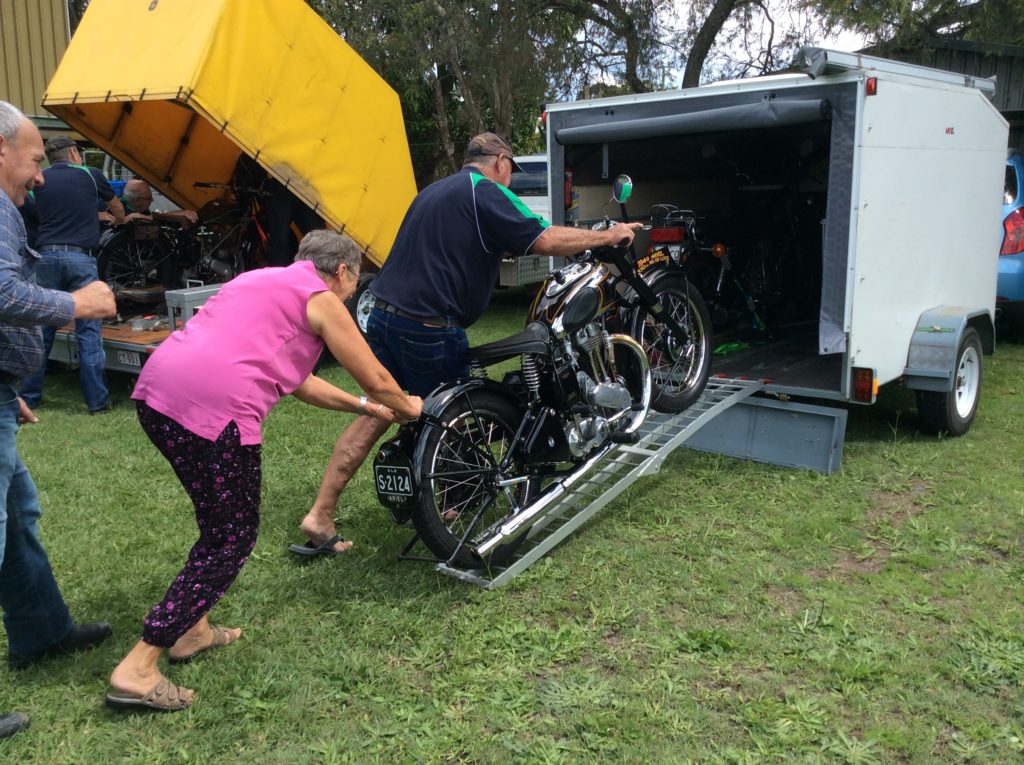 In the back yard of the clubhouse bikes were being loaded onto trailers.